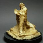 Effetto d'uomo che legge di Medardo Rosso