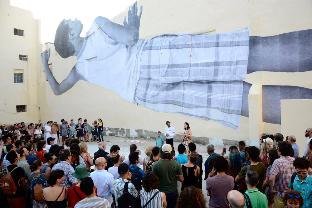 JR (Jean René), Giants, Alain, April 13, 08.22 p.m., Havana, Cuba, 2019, carta e olla d'amido, parete esterna dell'ex cinema Águila de Oro, nel Barrio Chino de L'Avana, a Cuba, Courtesy Galleria Continua